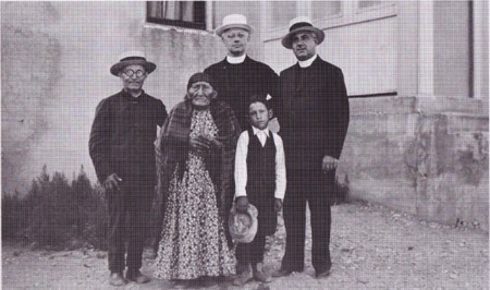 Eugene Buechel, Fathers Kiefer, S.J., and Dube, and Brother Hinderhofer, Mrs. Lightning, and little boy